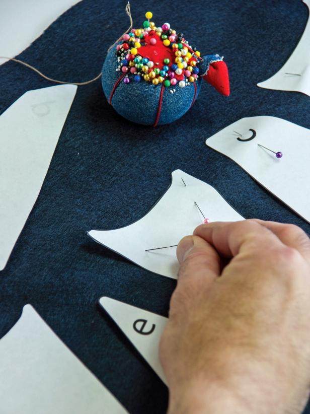 Lay the full wing templates on the black felt and pin them in place.