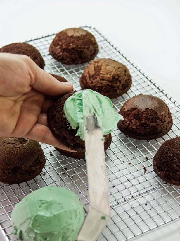 Coat the Cakes with an even layer of the colored marshmallow icing except for the bottom.