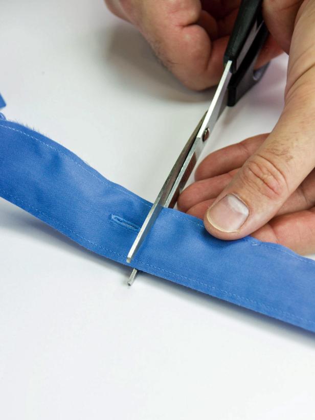 Cut the placket at the buttom after the last button hole.