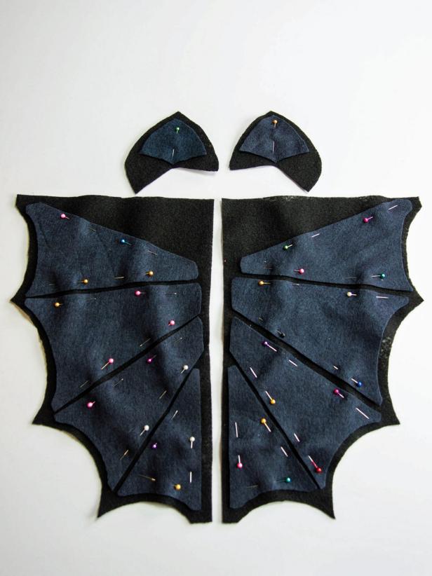 Remove the templates from all of the fabric cutouts and pin the segment pieces on the full wing cutouts.
