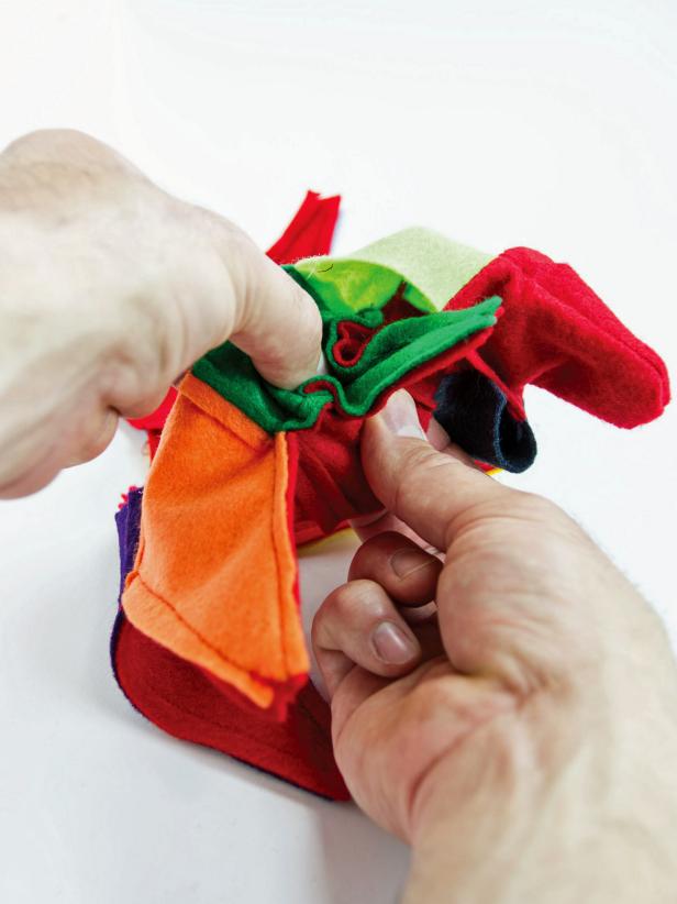 Carefully turn the points inside out pushing the tip out as much as possible.