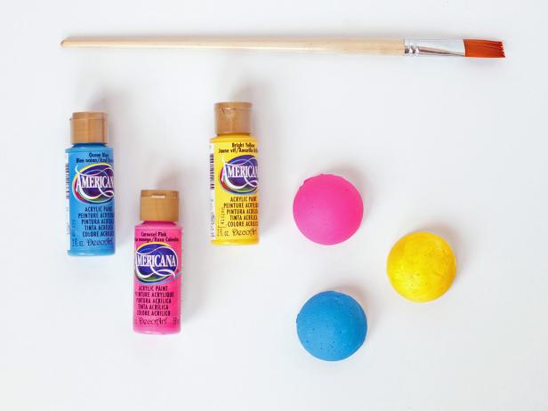 Paint six of them blue, six pink and six yellow. Allow to dry.