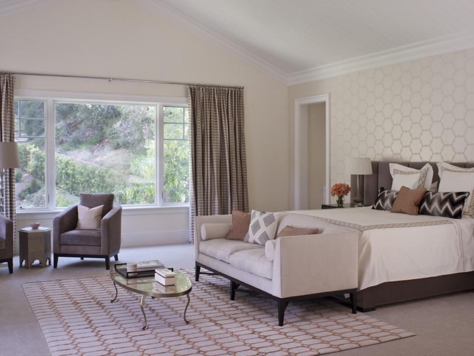 Serene Master Bedroom With Accent Wall and Sitting Area 