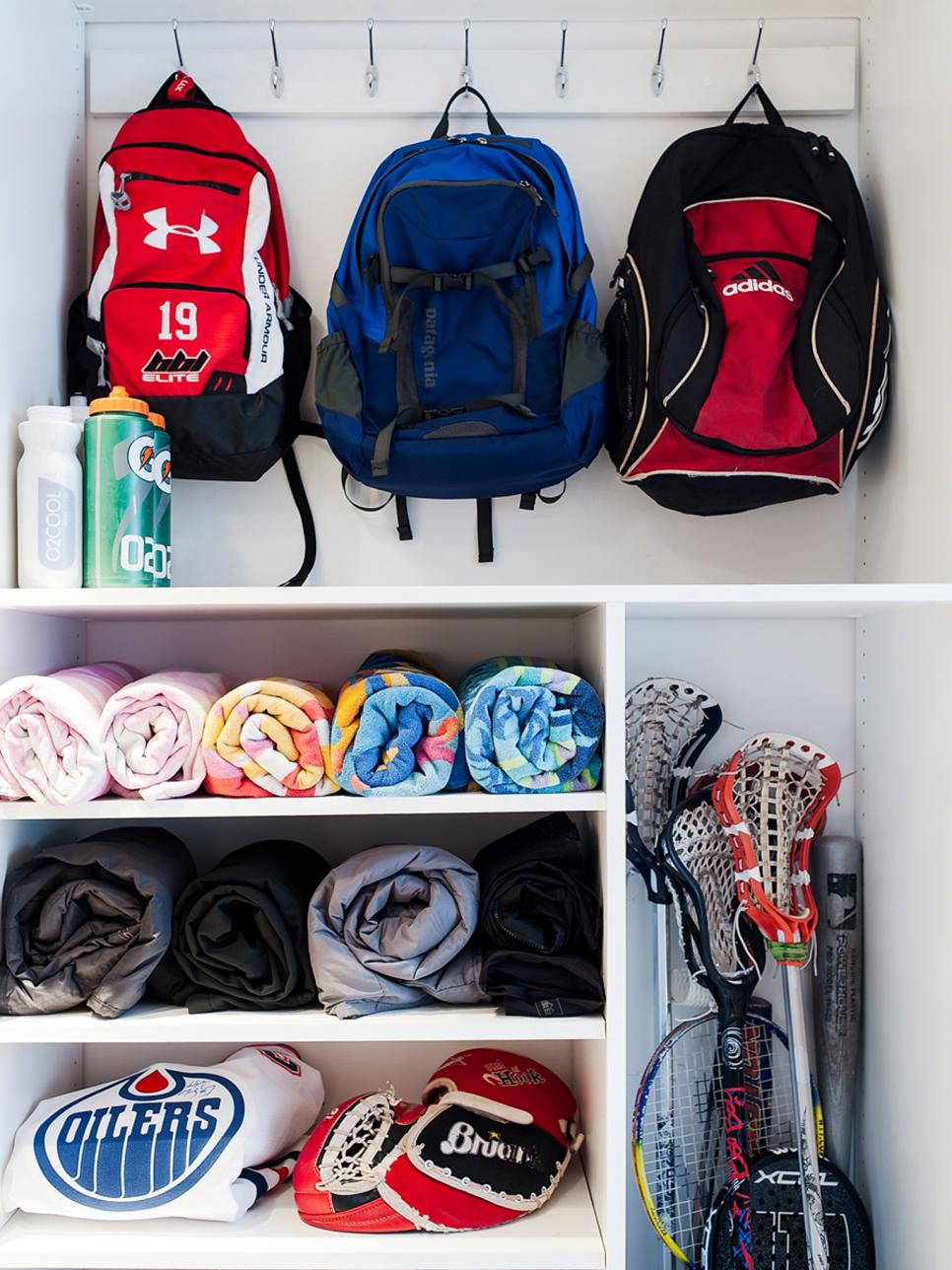 Backpacks and Sports Gear Stored in Closet Backpacks and Sports Gear Stored in Closet