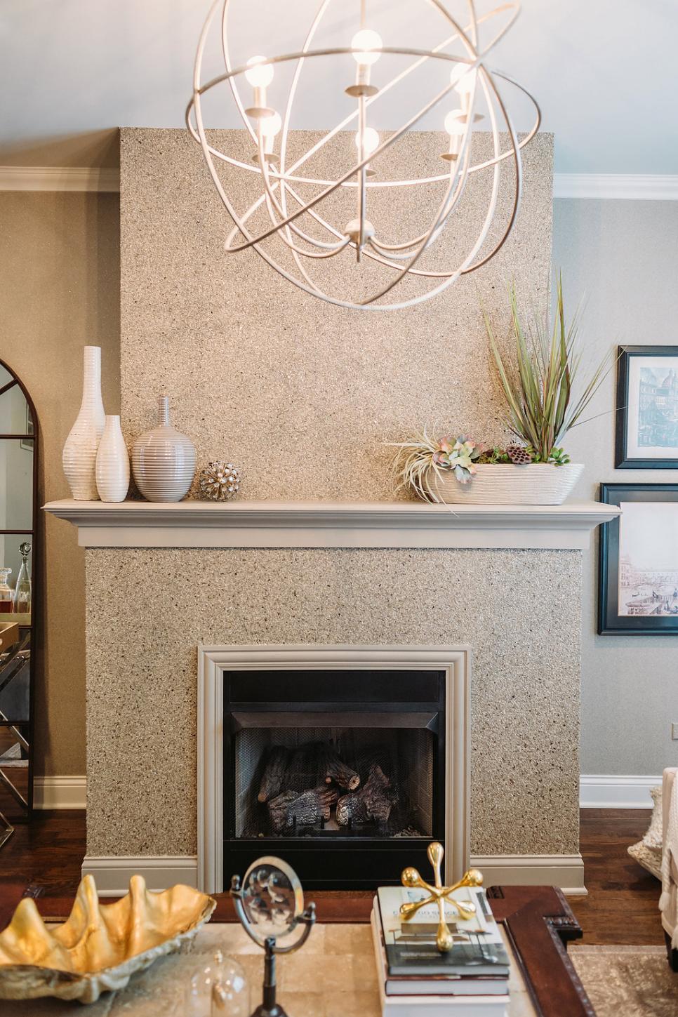 Traditional Fireplace and Globe Chandelier Neutral Fireplace With Vases and Plants on Mantel