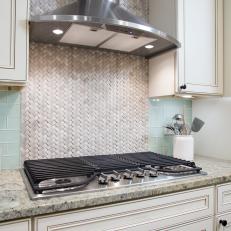 Gray Herringbone Backsplash and Range Hood