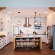 Kitchen With Large Center Island and Industrial Pendant Lights