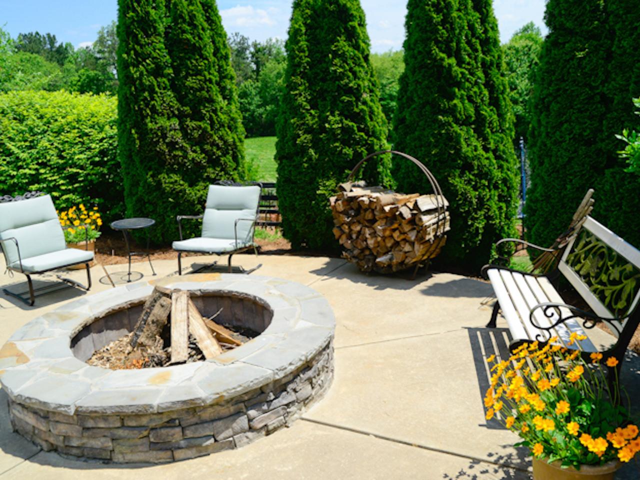 circle up stacked stone enhances this circular fire pit with a