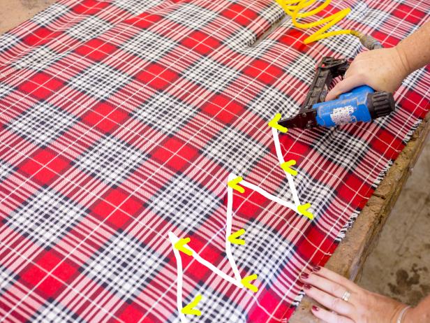 Once both boards have batting in place, itâs time to cover them with fabric. Place fabric on top of the tree and smooth out any wrinkles. If youâre working with a pattern, be sure to mark the center of the tree and pattern Make this the first place you staple, so that your fabric is centered properly You also may want to temporarily stretch your fabric across the tree, using a scrap board at the top of tree, to get a taut fabric Continue stapling the fabric on the tree, hitting each outer and inner corner first, then middle to secure the overall shape. If you used a board to pull the fabric tight, you can remove it now and cut the fabric away from it Next cut away excess fabric, leaving an inch overhang Finish stapling fabric along edges and trim again with scissors to remove excess fabric Repeat on the other board