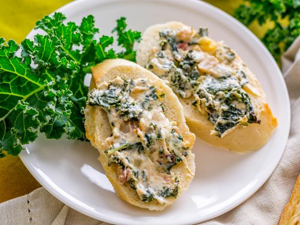 Kale dip on toasted bread slices Kale dip on toasted bread slices