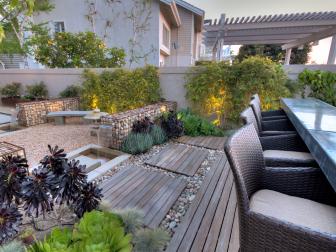 Succulent Garden Surrounding Wood Patio With Brown Wicker Chairs at Outdoor Dining Bar 
