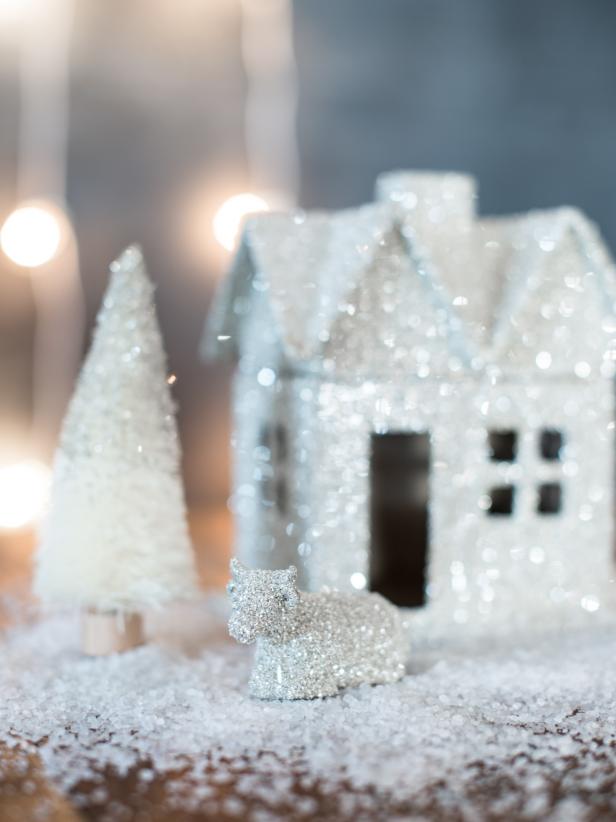 Inexpensive papier mache houses can become sparkling Christmas decorations with just some simple glue and German glass glitter. This glitter sparkles like no other and can make these simple objects look high-end.