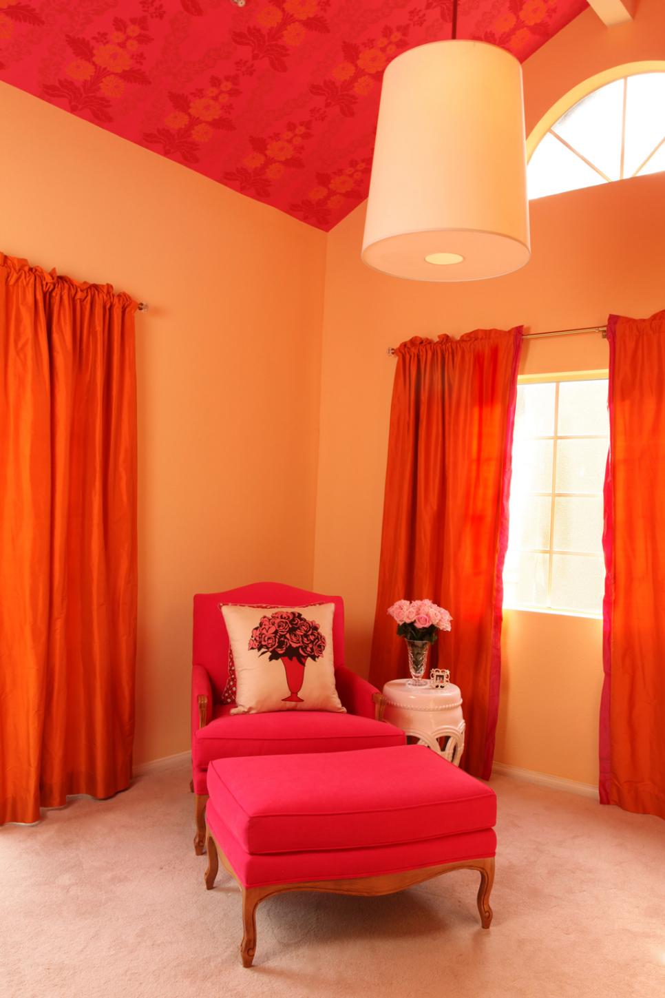 Bright Transitional Sitting Area Features Hot Pink Chair & Ottoman Transitional Sitting Room With Pink & Orange Accents