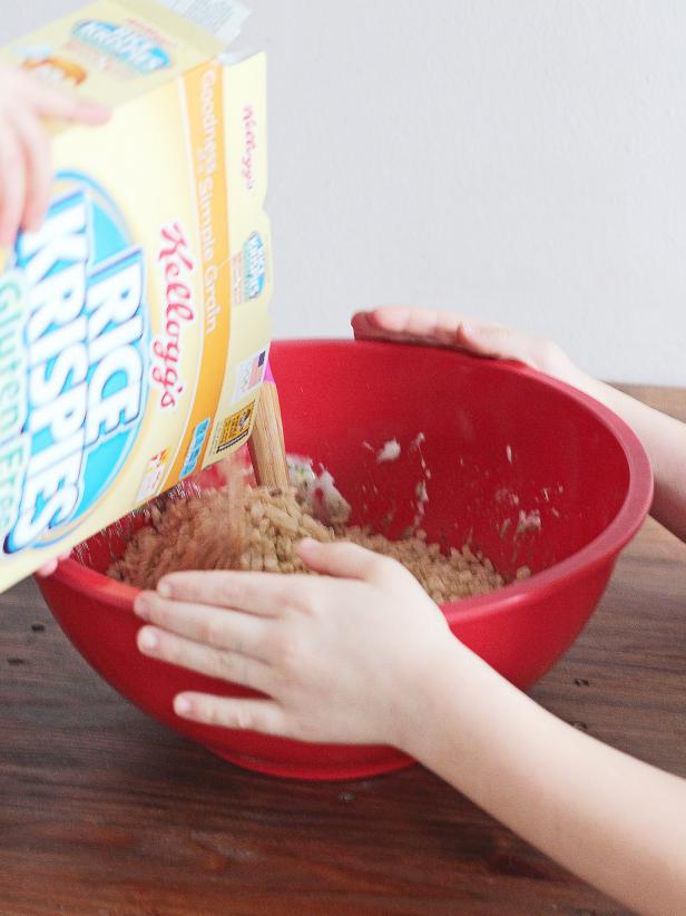 Add Rice Krispies cereal to a bowl to make shamrock-shaped treats this St. Patrick's Day.