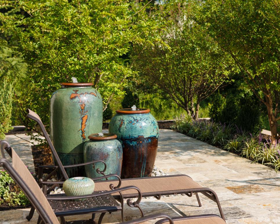 Trio of Patio Water Urns Patio With Lounge Chairs and Trio of Water Urns