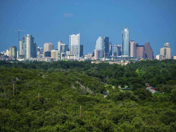 Austin Texas Skyline Mid Day blue sky with Greenbelt Austin Texas Skyline Mid Day blue sky with Greenbelt