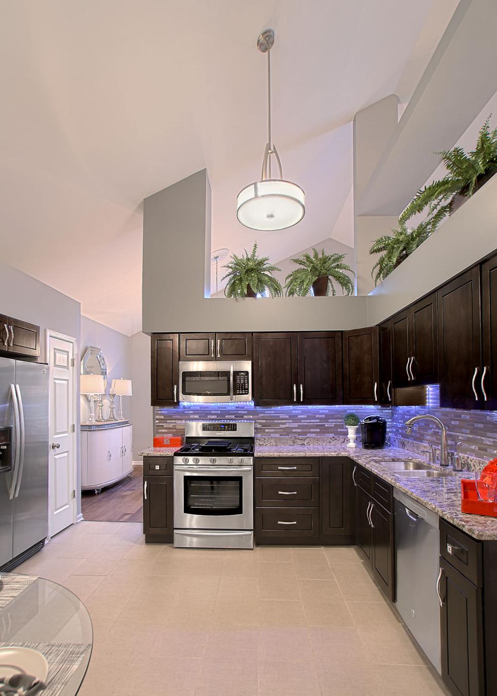 Contemporary Kitchen Features Dark Wood Cabinetry Gray Contemporary Kitchen With Dark Brown Cabinets
