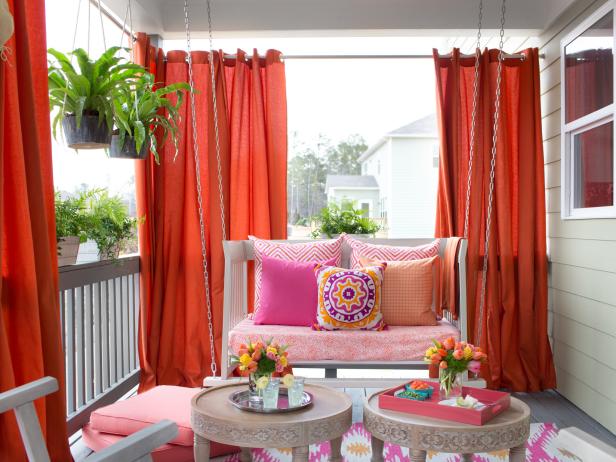 Vibrant Outdoor Space With Hanging Daybed and Draperies Vibrant Outdoor Space With Hanging Daybed and Draperies