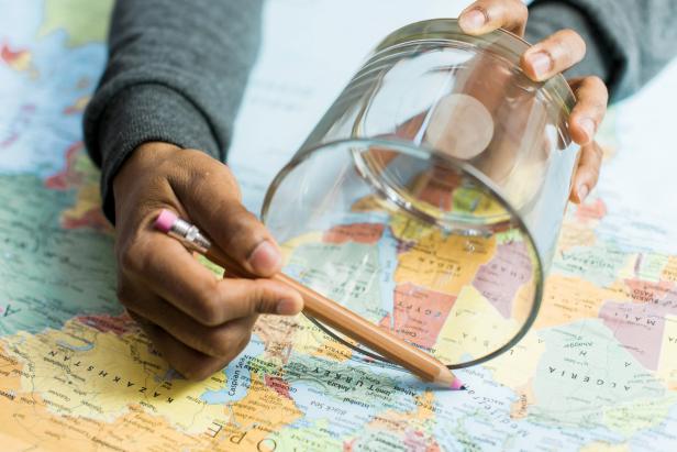Place the vessel on top of the map. Pencil in lines to mark just below the top and just above the bottom of the vessel.