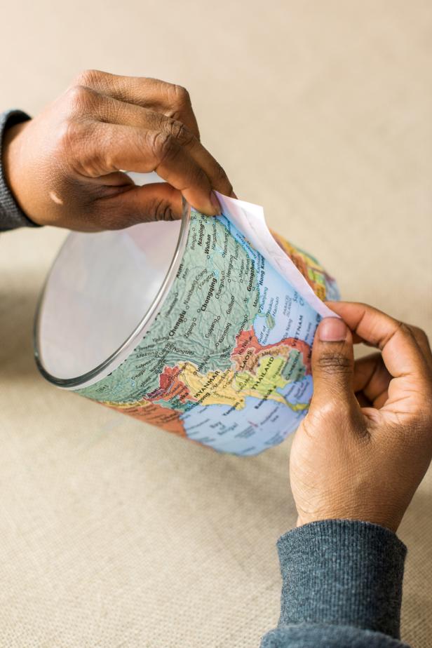 Add another piece of double-sided tape to the back of the unsecured end of the map strip.