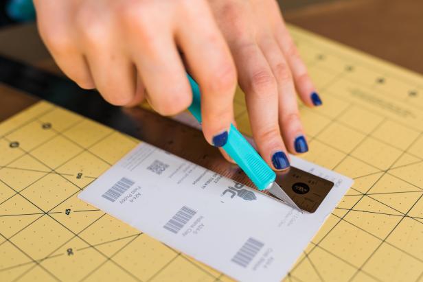 Use the craft knife to cut along the lines penciled in on the back of the paint chip.