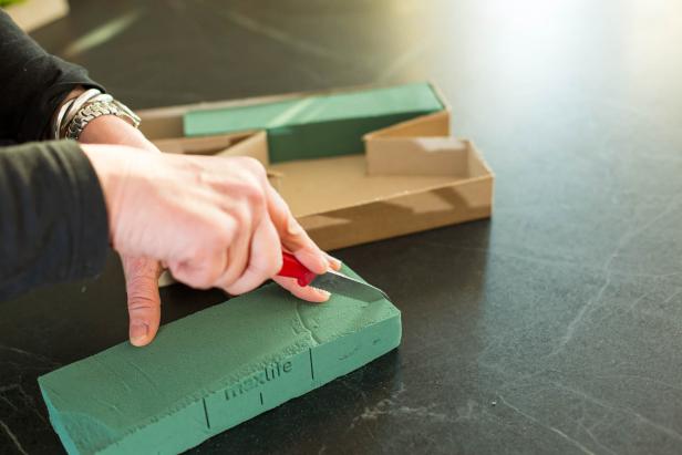 Cut the floral foam so it fits snugly inside each letter.