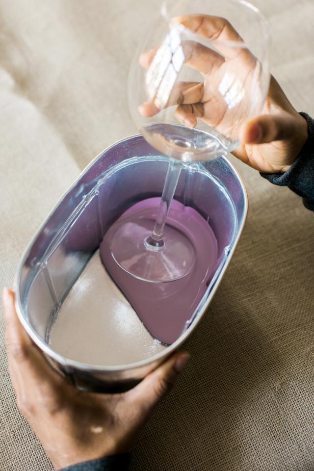 Dip the base of the wine glass into the paint.