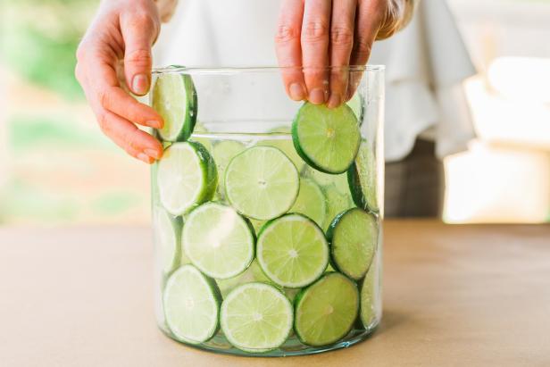 Starting at the bottom and working your way up, slide the fruit wheels between the two vessels until a solid layer is created all the way around.