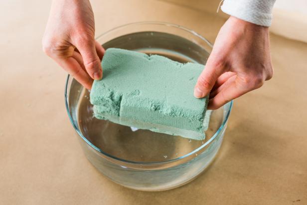 In order for the flowers to remain hydrated inside of the urn, you’ll need to soak the floral foam in water.