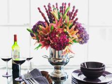 Add a colorful, edible touch to your centerpiece with a mix of fresh flowers and fresh fruit.
