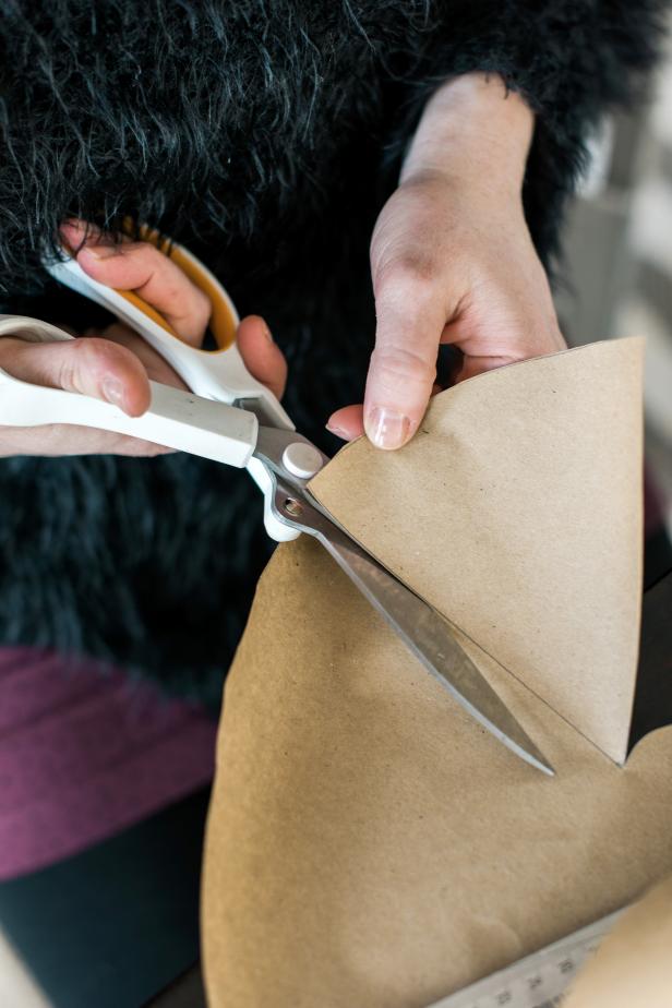 Use sharp scissors to cut around the circle. Next, cut out the wedge shape to create the cone template. TIP: The finished shape should look like a pie with a piece cut out of it.