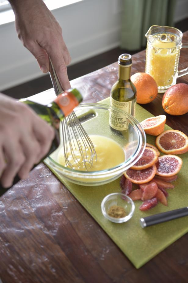 Pour the orange juice and white wine vinegar into a small bowl. Slowly whisk in the olive oil until it is emulsified. (Or place all ingredients in a jar, cover and shake!)