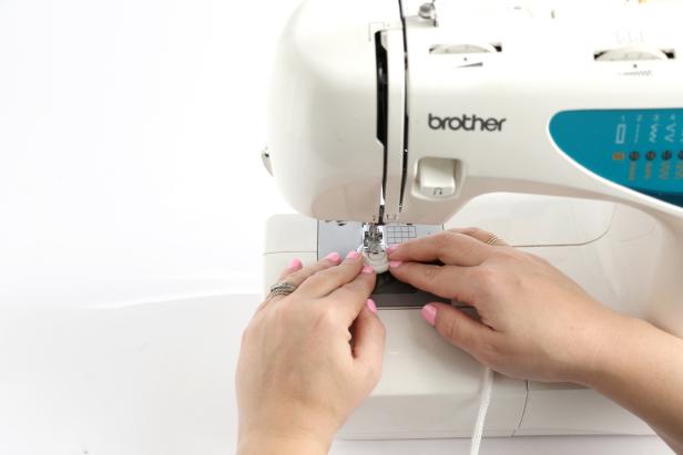 Starting on the side of one coil with the coil section on your left, use a zig zag stitch to sew the rope around the coil. As the sewing machine goes, twist the coil around to keep making it larger and larger.