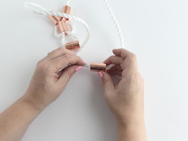 Then glue the right rope end into the right side of the piece. This is finishing off the necklace.