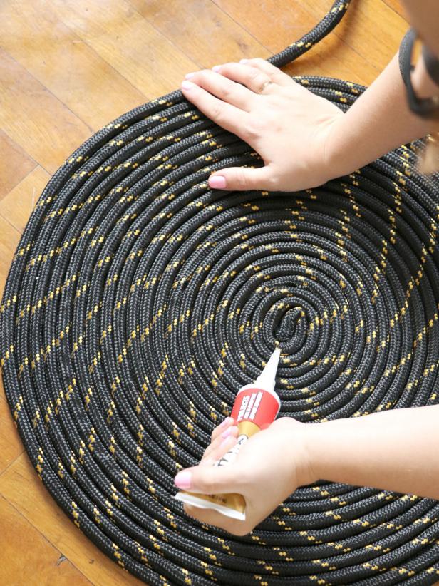 Use the liquid nails to create a starburst pattern on the rope coil.
