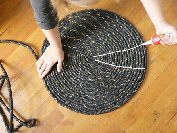Use the liquid nails to create a starburst pattern on the rope coil.