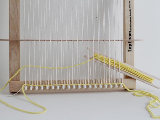 Now put the shed stick under every other warp yarn in the opposite direction. Put it under the opposite yarns you used the first time.
