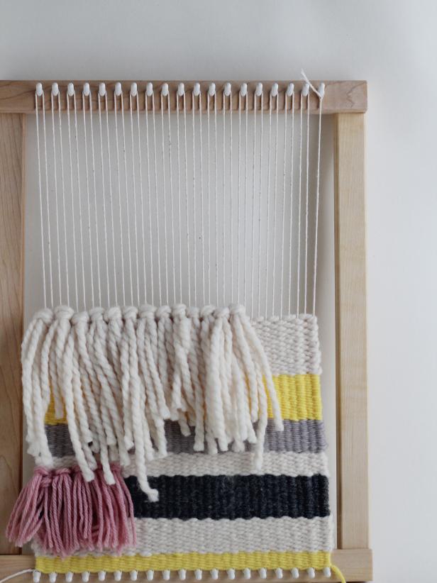 Use the same weaving technique youâve been going to create the stripes, although only create a shed from the end of the fringe to the right of the tapestry. Weave only on the right of the fringe until you make a stripe the same width as the fringe knots.