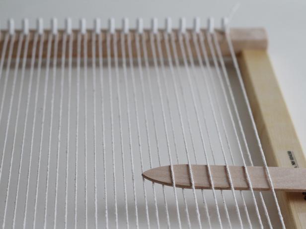 To weave, you are going to use the shed stick and the stick shuttle. The shed stick looks like a big tongue depressor.