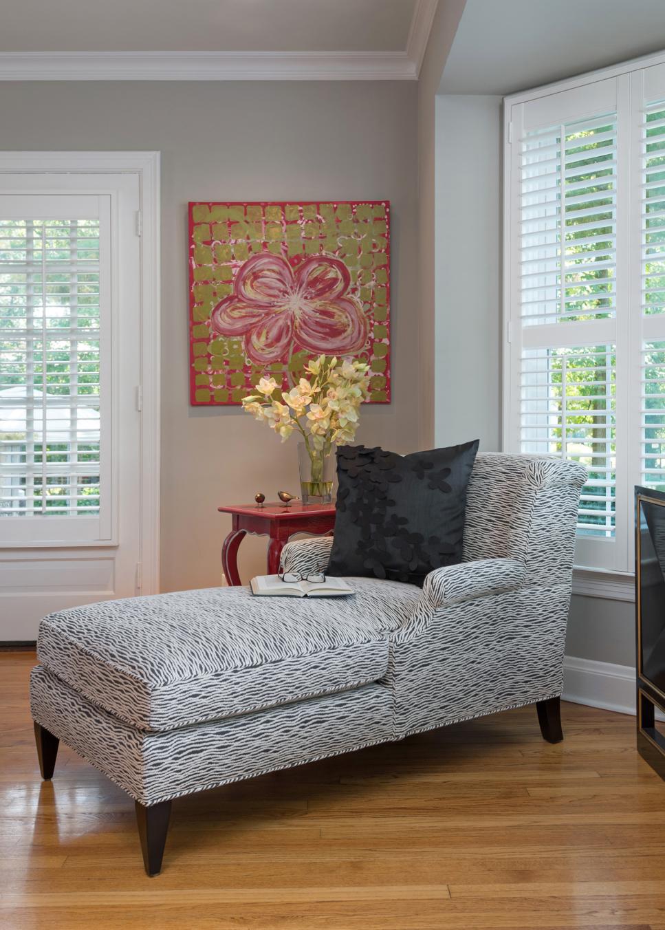 Graphic Black & White Chaise Lounge Black & White Chaise With Red End Table & Vase of Yellow Flowers