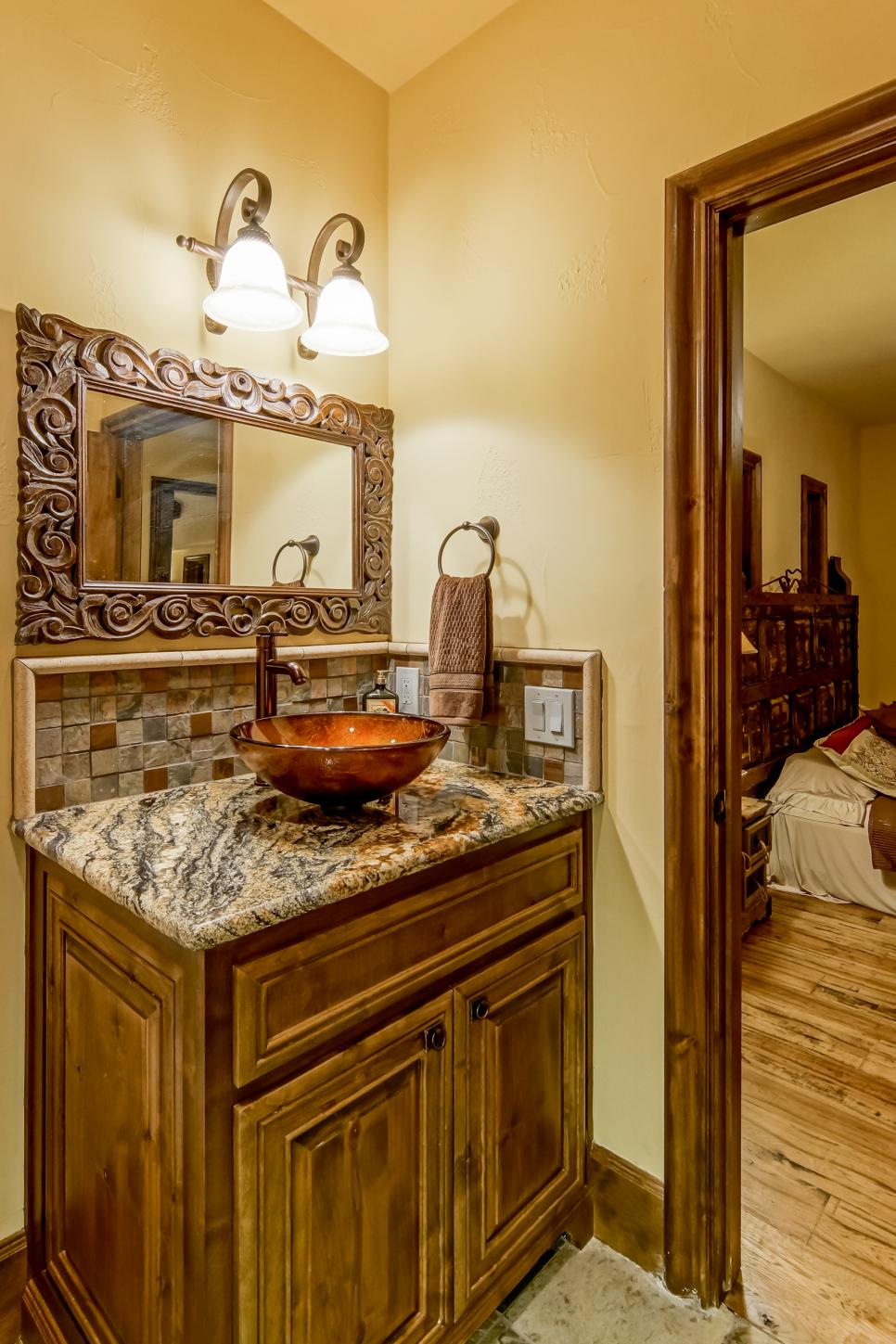 Vessel Sink & Tumbled Tile Backsplash Neutral Bathroom With Wood Vanity, Orange Vessel Sink, Wood Mirror