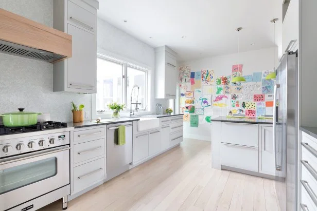 White Contemporary Kitchen With White Cabinets & Light Wood Floors