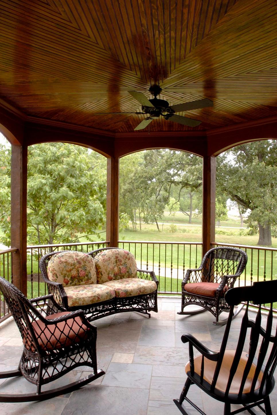 Round Veranda With Wood Ceiling & Rocking Chairs Traditional Roofed Porch With Black Outdoor Furniture & Ceiling Fan