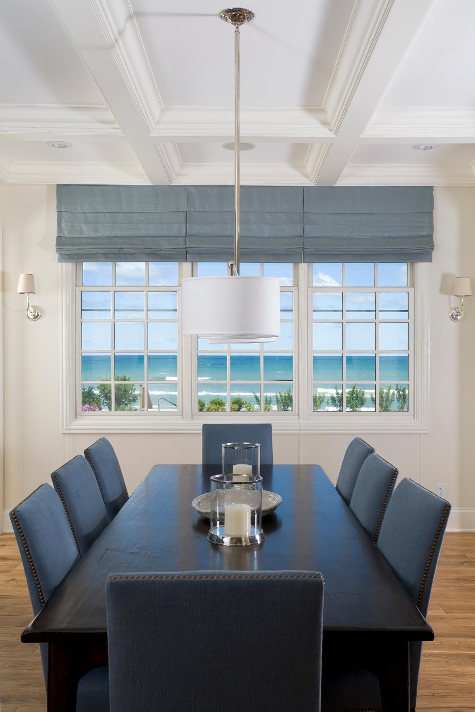 Bright & Airy Dining Room Boasts Stunning Water Views Neutral Transitional Dining Room With Coffered Ceiling & Blue Chairs