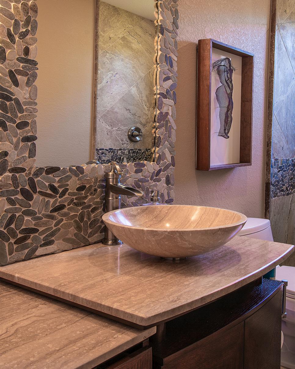 Pebble Mosaic Mirror Surround in Earth-Toned Bathroom Gray Stone Bathroom Countertop and Vessel Sink