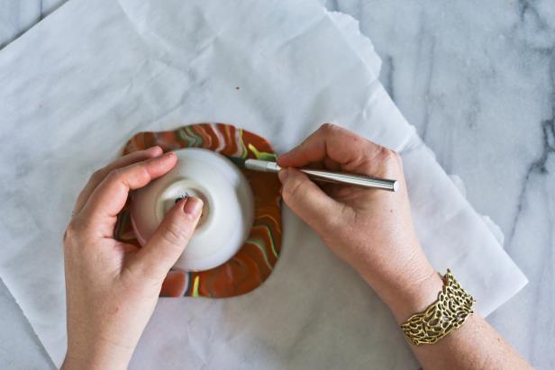 Make Mom a clay jewelry dish this Mother's Day. The turquoise and gold marbled accent colors add glamour to the terra cotta-colored dish.