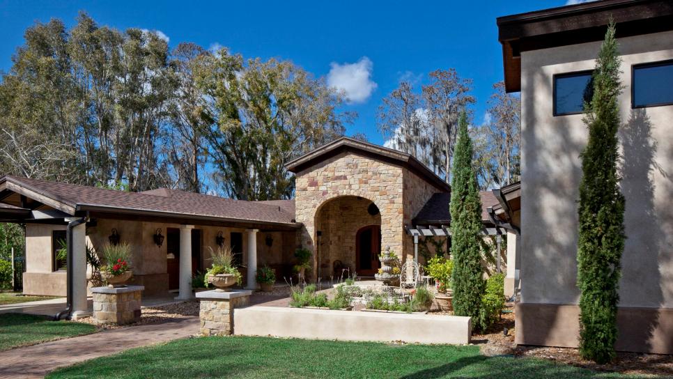 Tuscan-Style Home Exterior With Stone Archway Neutral Stone and Stucco Tuscan Home Exterior