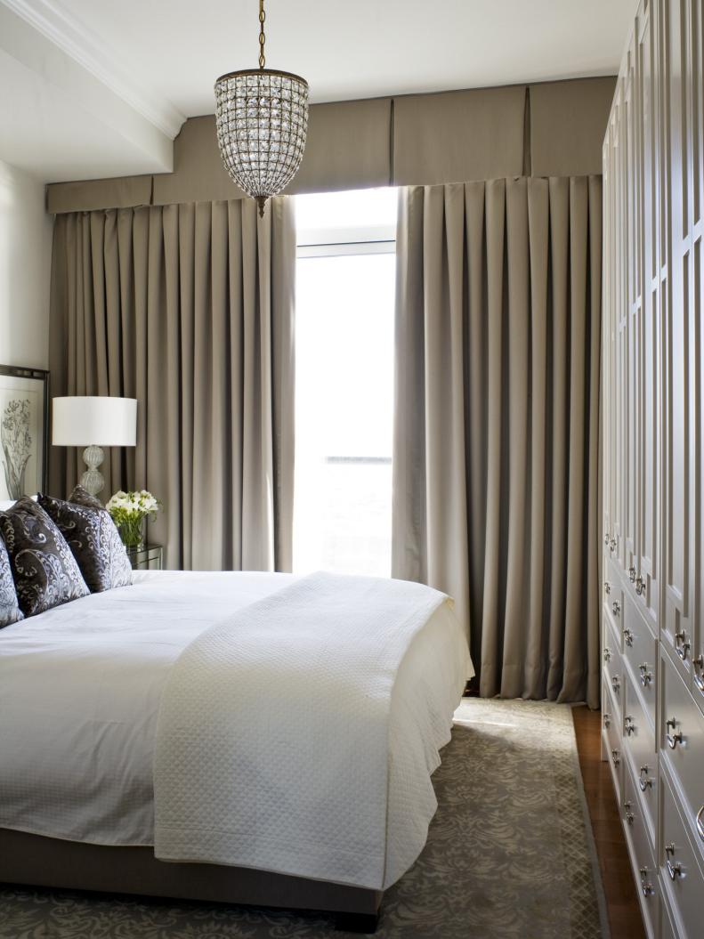 Small, Sophisticated Bedroom With Floor-to-Ceiling Draperies