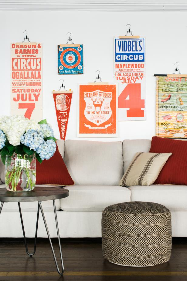 Vintage Art on Wooden Hangers Above Sofa Vintage Art on Wooden Hangers Above Sofa