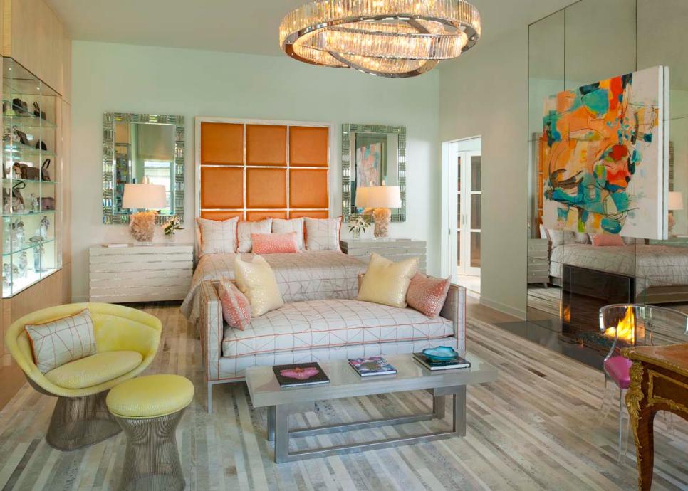 Master Bedroom Features Bold Orange Accents & Mod Seating Area Neutral Contemporary Bedroom With Orange Headboard & Neutral Furniture